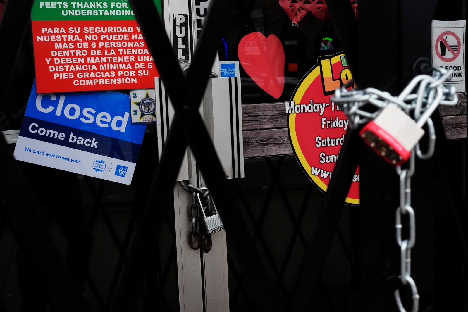 A closed sign is displayed at a mini grocery store in the Little Village neighborhood of Chicago, Monday, Feb. 3, 2025. (AP Photo/Nam Y. Huh)