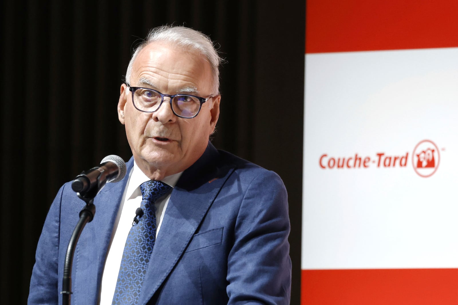 Alain Bouchard, chairman of Canada’s Alimentation Couche-Tard, speaks during a press conference in Tokyo, Thursday, March 13, 2025. (Kyodo News via AP)