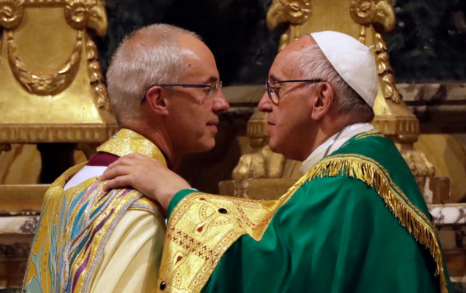 FILE - Pope Francis, right, greets the archbishop of Canterbury, Justin Welby, during vespers prayers in the church of San Gregorio al Celio, in Rome, Wednesday, Oct. 5, 2016. (AP Photo/Gregorio Borgia, File)