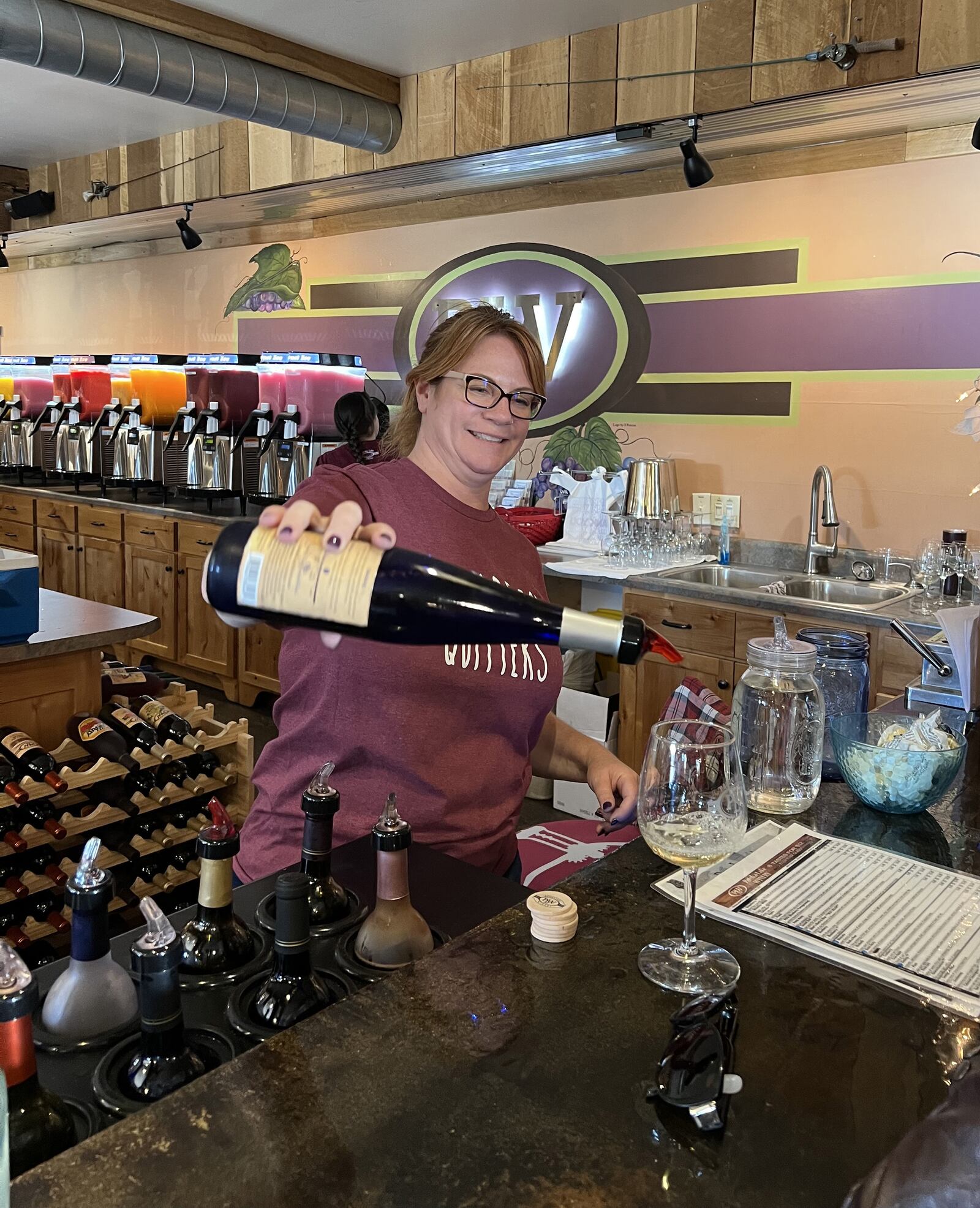 JoLee Kasprzak, one of the managers of Patoka Lake Winery in Birdseye, pours samples of wine for customers. The winery also includes overnight accommodations with winery suites and unique silo suites that are converted from silos. Wine cruises are offered at nearby Patoka Lake Marina. MARY ANN ANDERSON/TRIBUNE NEWS SERVICE