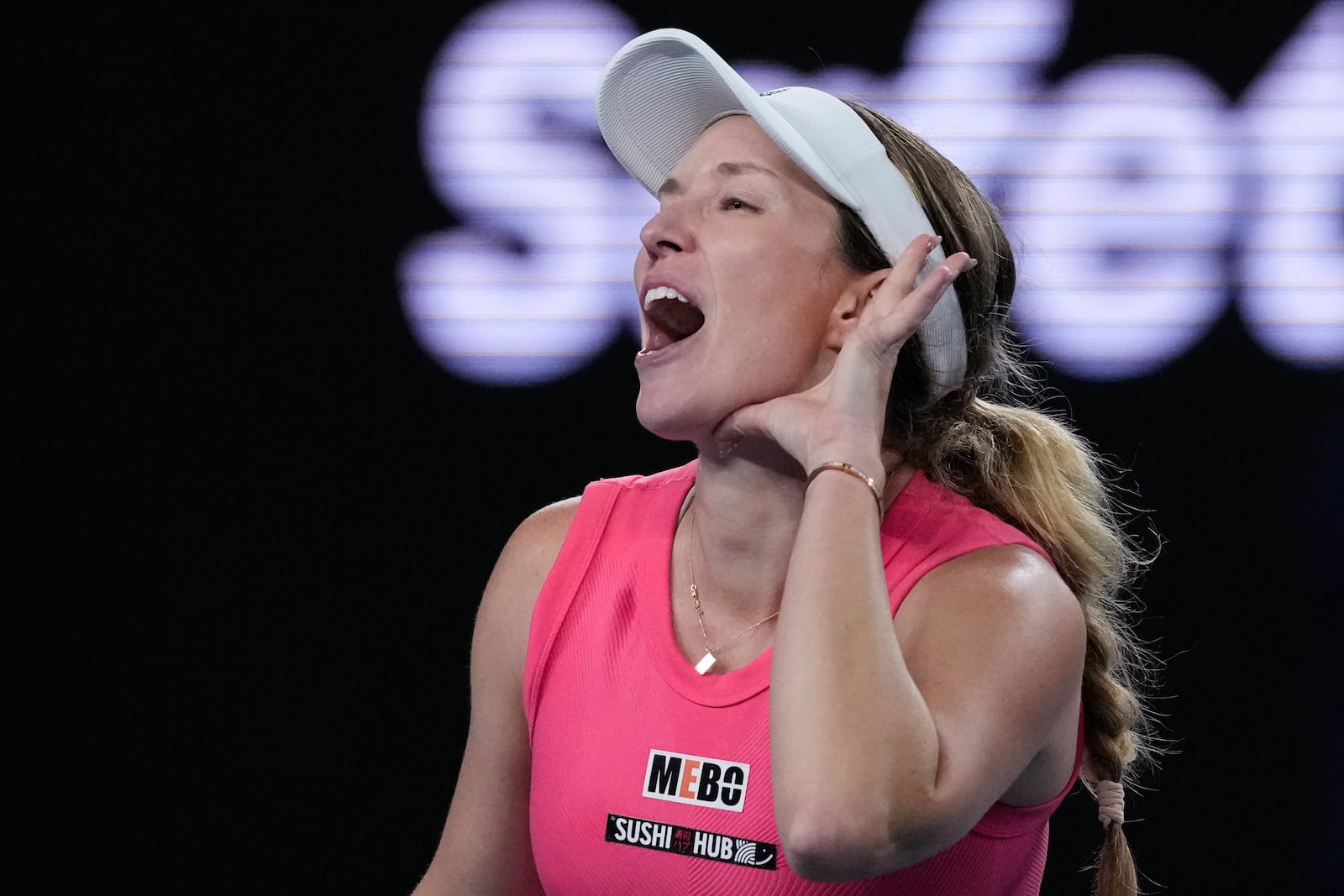 Danielle Collins of the U.S. reacts after defeating Destanee Aiava of Australia in their second round match at the Australian Open tennis championship in Melbourne, Australia, Thursday, Jan. 16, 2025. (AP Photo/Manish Swarup)