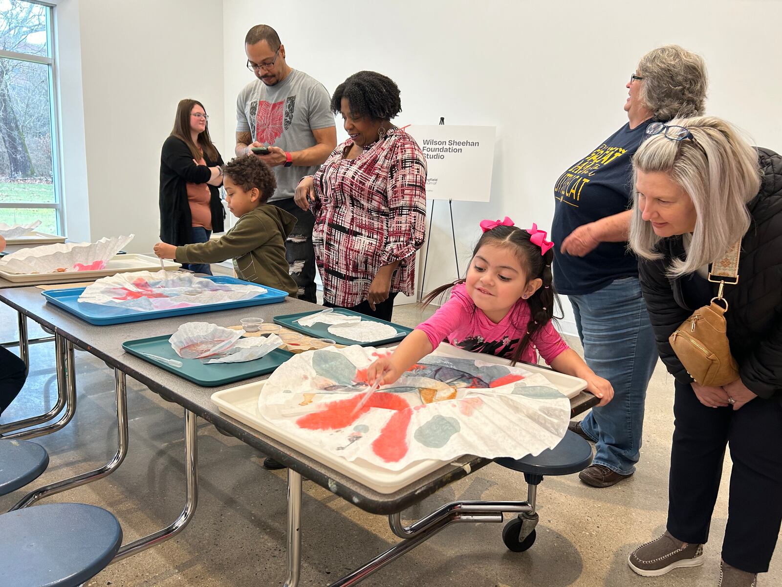 Preschool students from Clark Early Learning Center, their parents and school staff painted to show how one of the new studios will be used during the Springfield Museum of Art's celebration of its newly renovated north wing on Saturday.