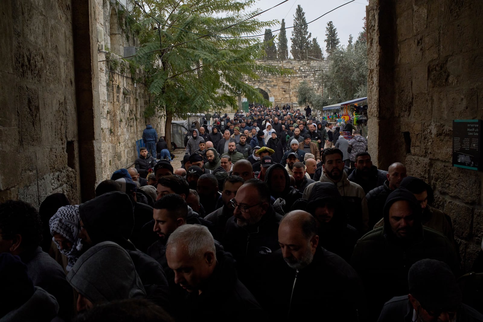 Muslim worshippers leave the Al-Aqsa Mosque compound after attending the Friday prayers of the Muslim holy month of Ramadan in the Old City of Jerusalem, Friday, March 7, 2025. (AP Photo/Leo Correa)