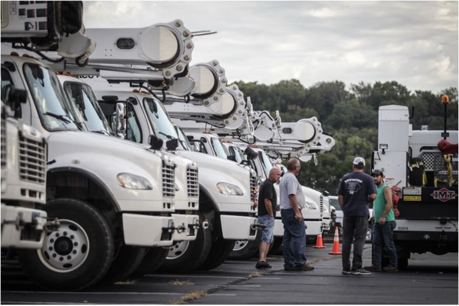 Employees and contractors with Iowa-based MidAmerican Energy Company spent Tuesday night (Sept. 3, 2019) in Dayton before continuing on to a staging area in North Carolina for Hurricane Dorian recovery efforts. (Jim Noelker/Staff)