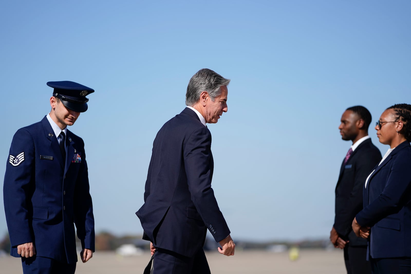 Secretary of State Antony Blinken walks to board a plane en route to the Middle East as he departs Joint Base Andrews, Md., Monday, Oct. 21, 2024. (Nathan Howard/Pool Photo via AP)