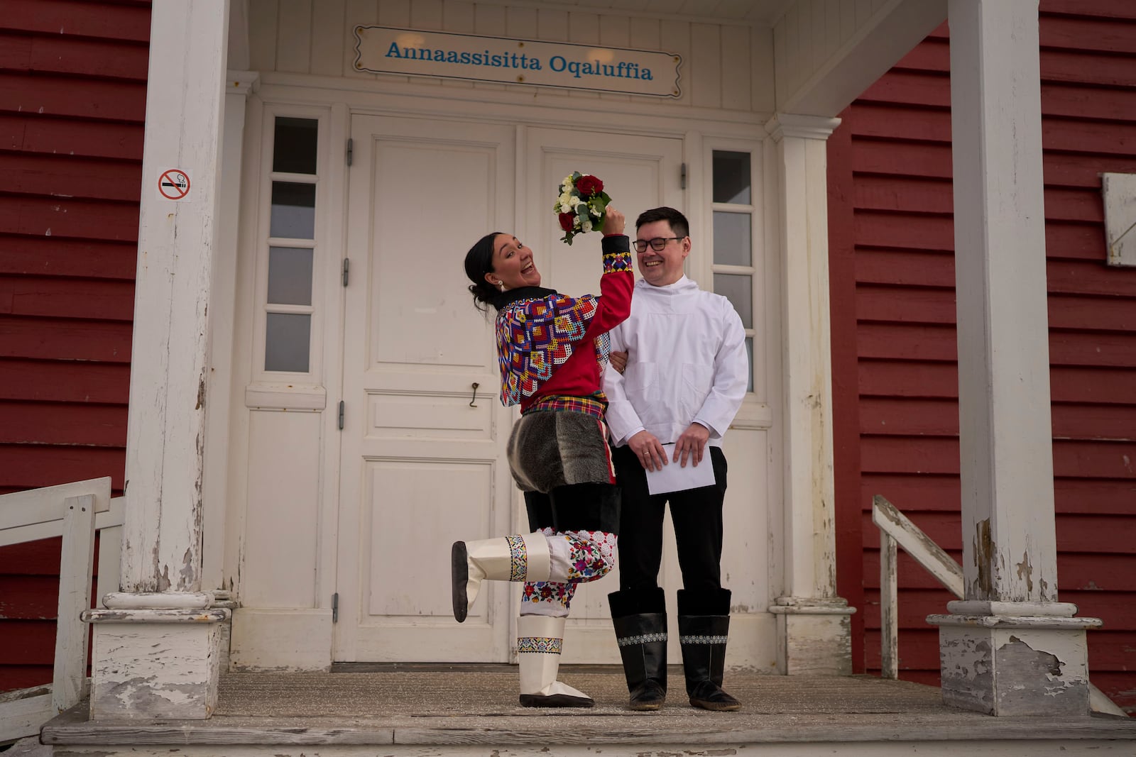 Salik Schmidt and Malu Schmidt react after getting married during their weeding at the church of our Savior in Nuuk, Greenland, Saturday, Feb. 15, 2025. (AP Photo/Emilio Morenatti)