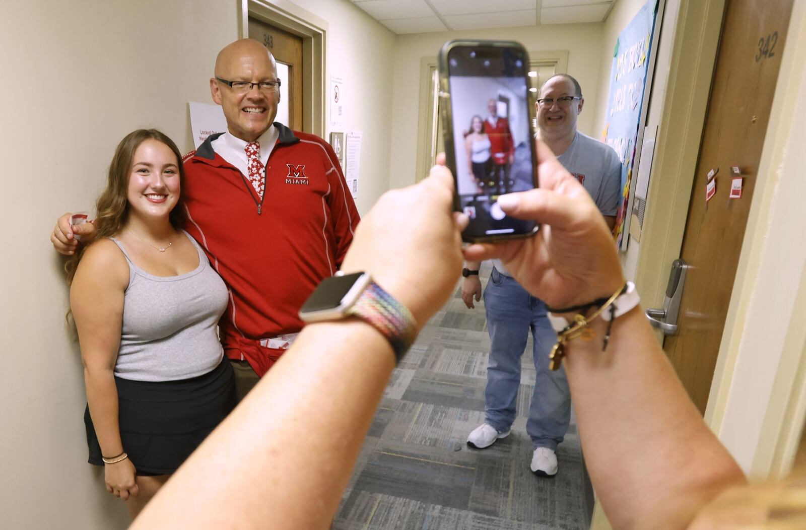 Audra Bergman gets her photo taken with Miami University President Greg Crawford during move in at Tappan Hall Friday, Aug. 23, 2024 at Miami University in Oxford. NICK GRAHAM/STAFF