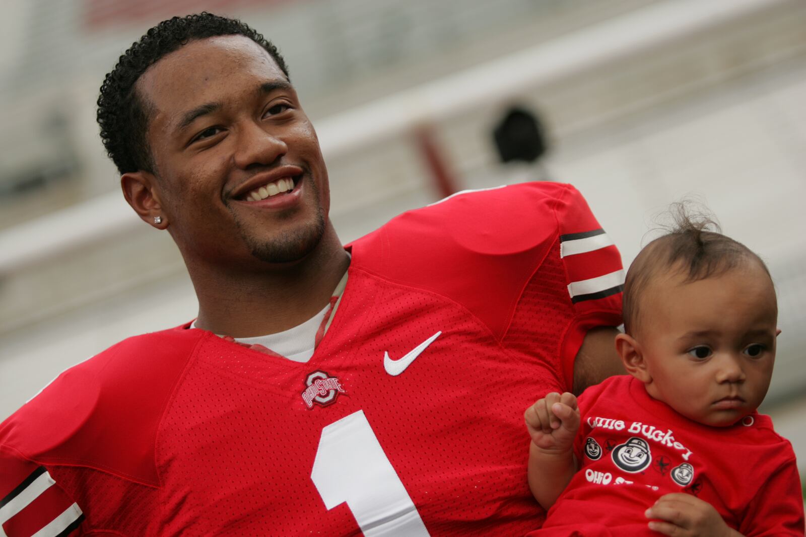 Ohio State’s Marcus Freeman holds his 8-month-old daughter Bria at Ohio Stadium during media photo in 2007. Jim Witmer/Staff