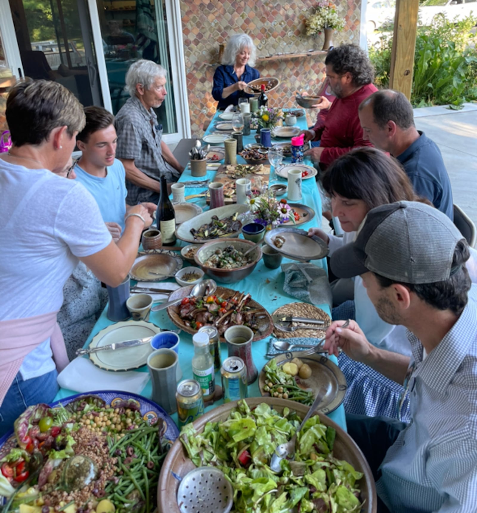 Potter Naysan Mcllhargey and his family entertain large dinner parties at their Yellow Springs home. His pottery is central to the gatherings.