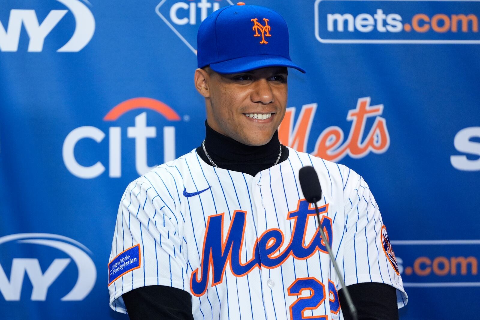 New York Mets' Juan Soto smiles during a baseball news conference, Thursday, Dec. 12, 2024, in New York. (AP Photo/Frank Franklin II)