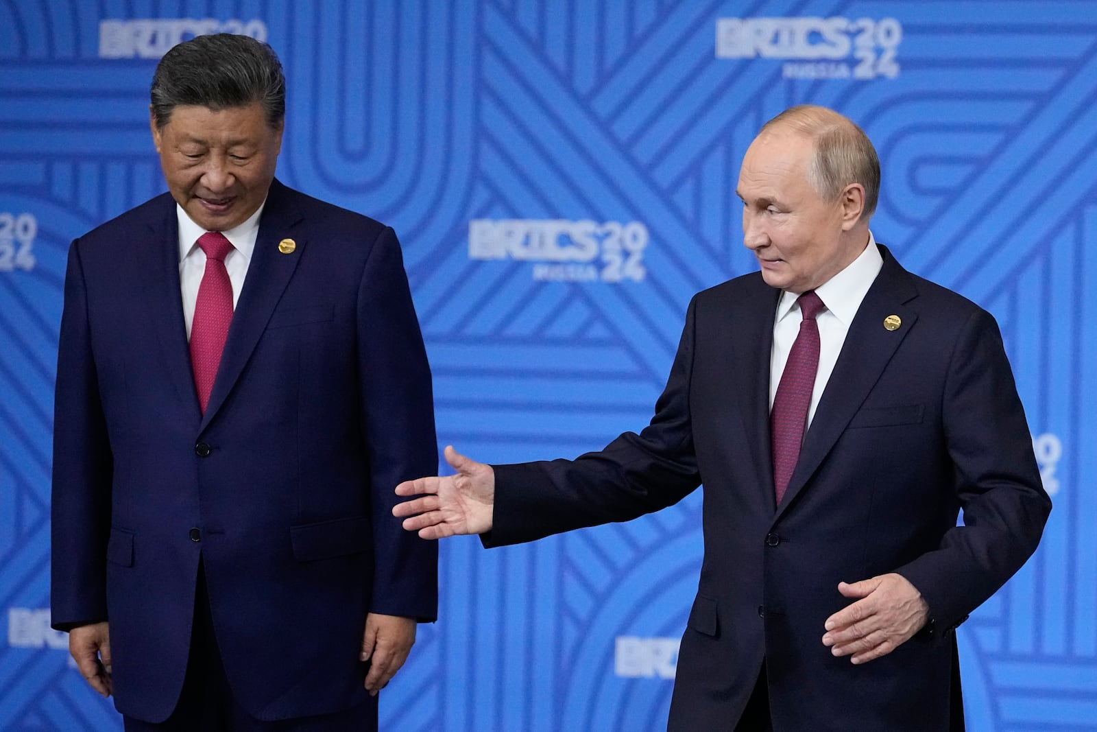 Chinese President Xi Jinping, left, and Russian President Vladimir Putin attend a family photo ceremony prior to the BRICS Summit plenary session in Kazan, Russia, Wednesday, Oct. 23, 2024. (AP Photo/Alexander Zemlianichenko, Pool)