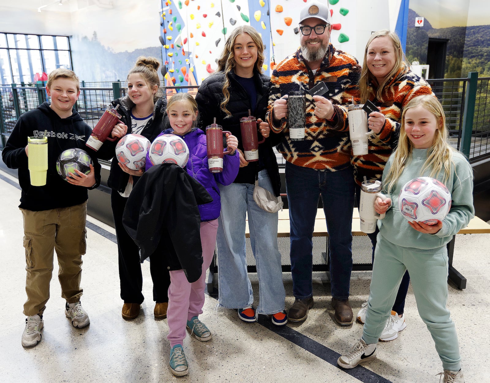 The Forshee family smiles with goodies they received during the grand opening of Dick's House of Sport in Beavercreek, March 7, 2025. MARSHALL GORBY\STAFF