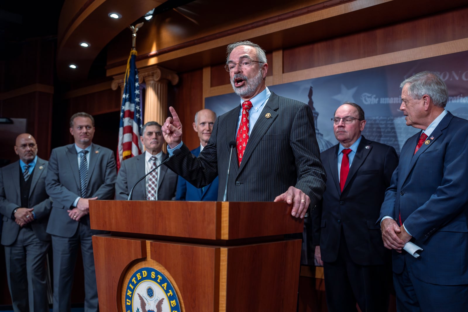 Rep. Andy Harris, R-Md., chairman of the House Freedom Caucus, joins a group of conservative Republicans to complain to reporters about the interim spending bill being crafted to avoid a shutdown of federal agencies, at the Capitol in Washington, Wednesday, Dec. 18, 2024. (AP Photo/J. Scott Applewhite)