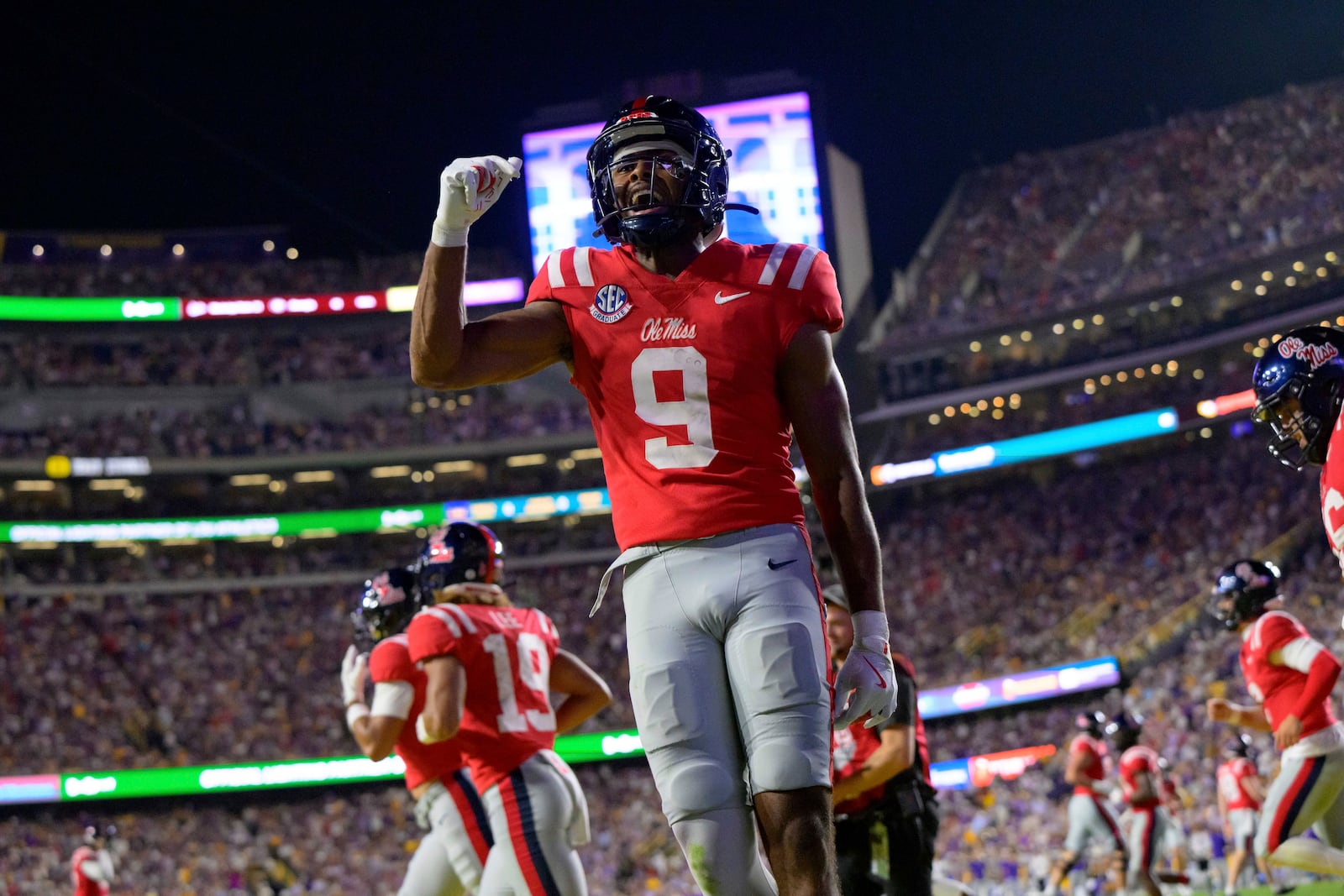 Mississippi wide receiver Tre Harris (9) celebrates after touchdown reception in the end zone against LSU during the first half of an NCAA college football game in Baton Rouge, La., Saturday, Oct. 12, 2024. (AP Photo/Matthew Hinton)