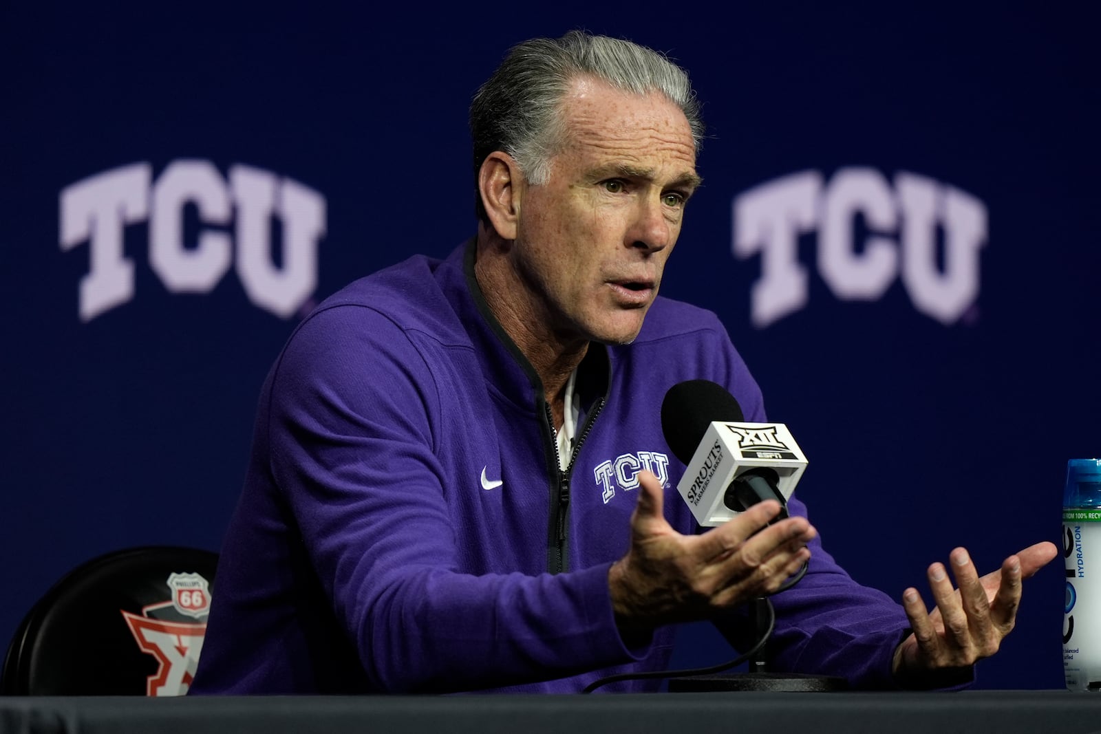 TCU head coach Jamie Dixon addresses the media during the NCAA college Big 12 men's basketball media day, Wednesday, Oct. 23, 2024, in Kansas City, Mo. (AP Photo/Charlie Riedel)