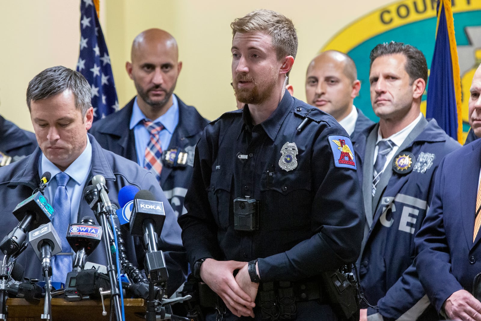 Altoona Police officer Tyler Frye, center, speaks during a press conference regarding the arrest of suspect Luigi Mangione, Monday, Dec. 9, 2024, in Hollidaysburg, Pa., in the fatal shooting of UnitedHealthcare CEO Brian Thompson. (AP Photo/Ted Shaffrey)