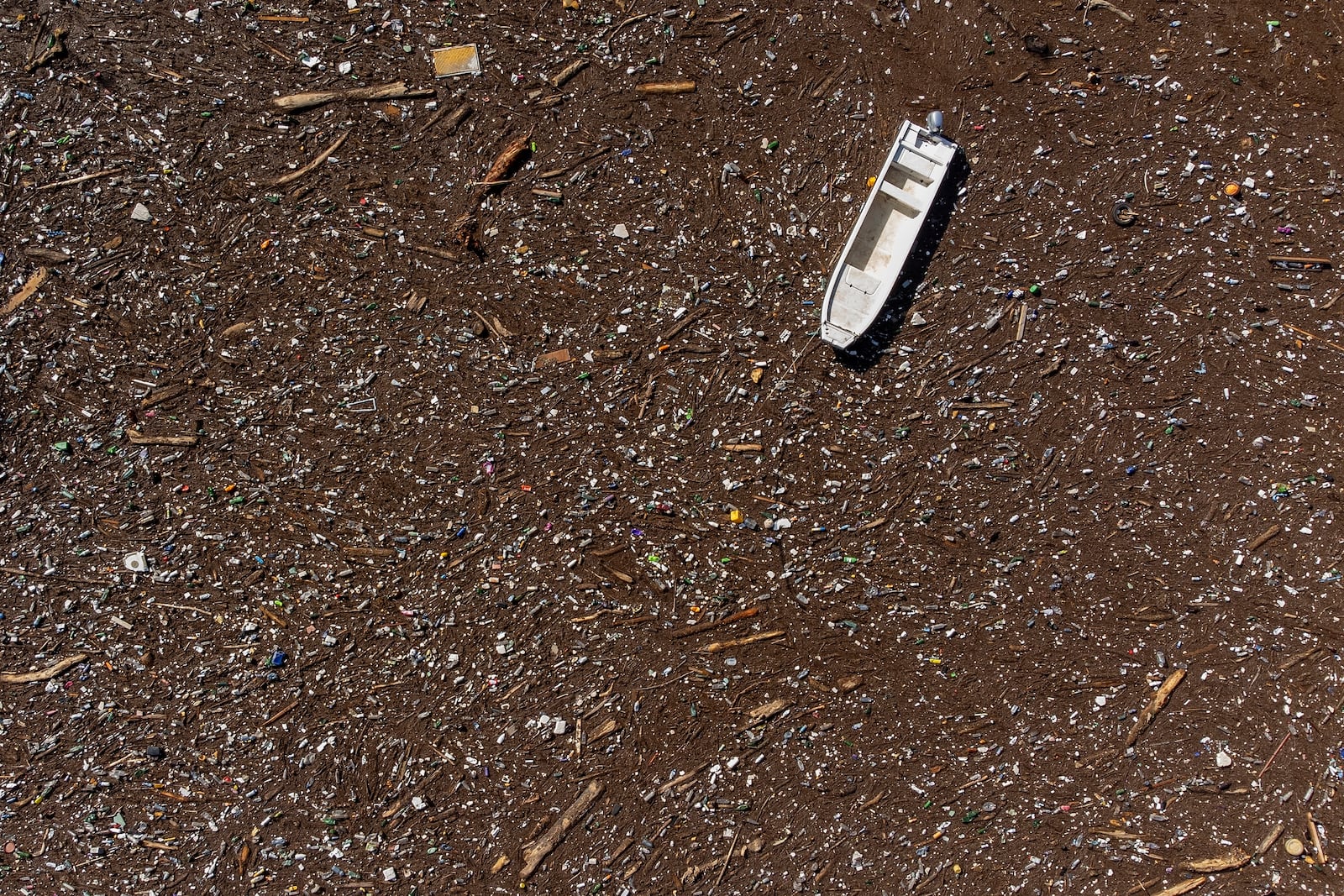 FILE - A boat is stuck near a dam on the Neretva River in Grabovica, Bosnia, Oct. 13, 2024. (AP Photo/Armin Durgut, File)