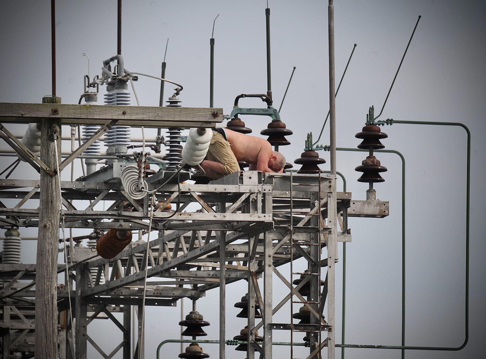 A man climbed atop an Ohio Edison power substation in Moorefield Twp., Clark County on Monday, Oct. 11, 2021. After nearly four hours, negotiators talked him down safely. Electricity to nearly 2,500 customers had been cut off during the standoff. MARSHALL GORBY/STAFF