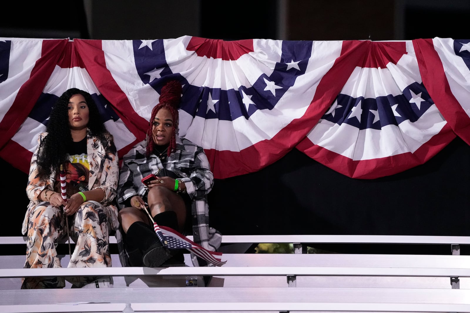 Supporters sit in the bleachers as people leave an election night campaign watch party for Democratic presidential nominee Vice President Kamala Harris after it was announced that she would not speak on Wednesday, Nov. 6, 2024, on the campus of Howard University in Washington. (AP Photo/Mark Schiefelbein)