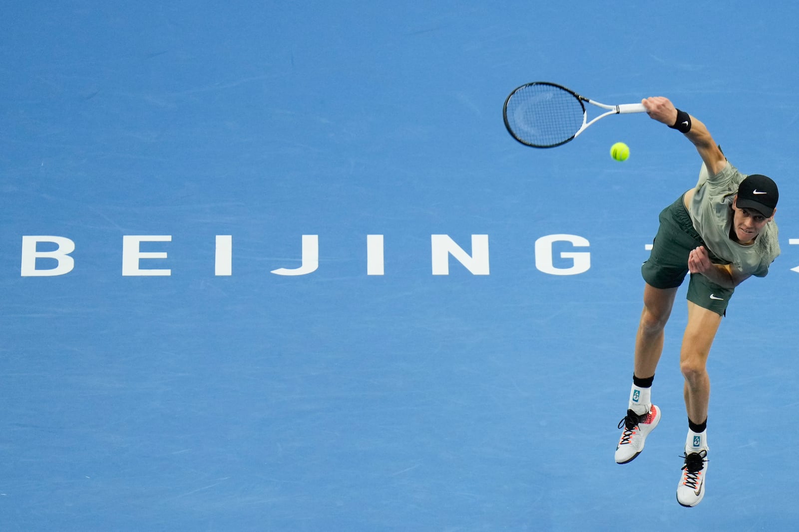 Jannik Sinner of Italy serves against Carlos Alcaraz of Spain during their men's singles finals match of the China Open tennis tournament, at the National Tennis Center in Beijing, Wednesday, Oct. 2, 2024. (AP Photo/Andy Wong)