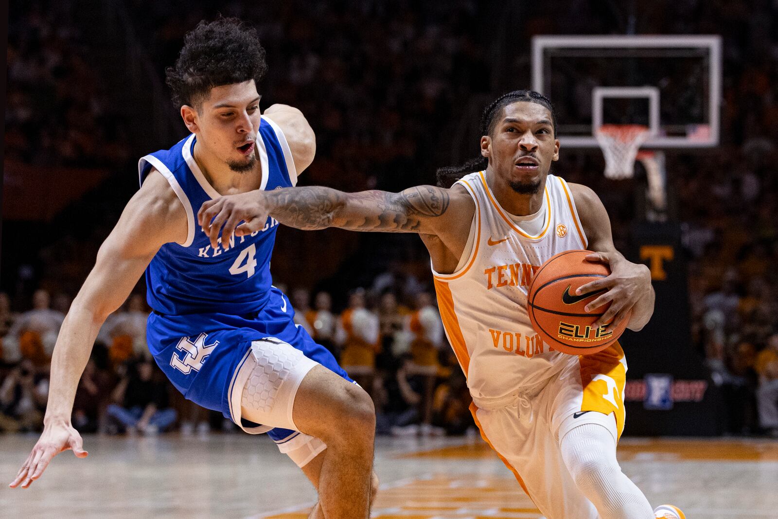 Tennessee guard Zakai Zeigler (5) drives against Kentucky guard Koby Brea (4) during the first half of an NCAA college basketball game Tuesday, Jan. 28, 2025, in Knoxville, Tenn. (AP Photo/Wade Payne)