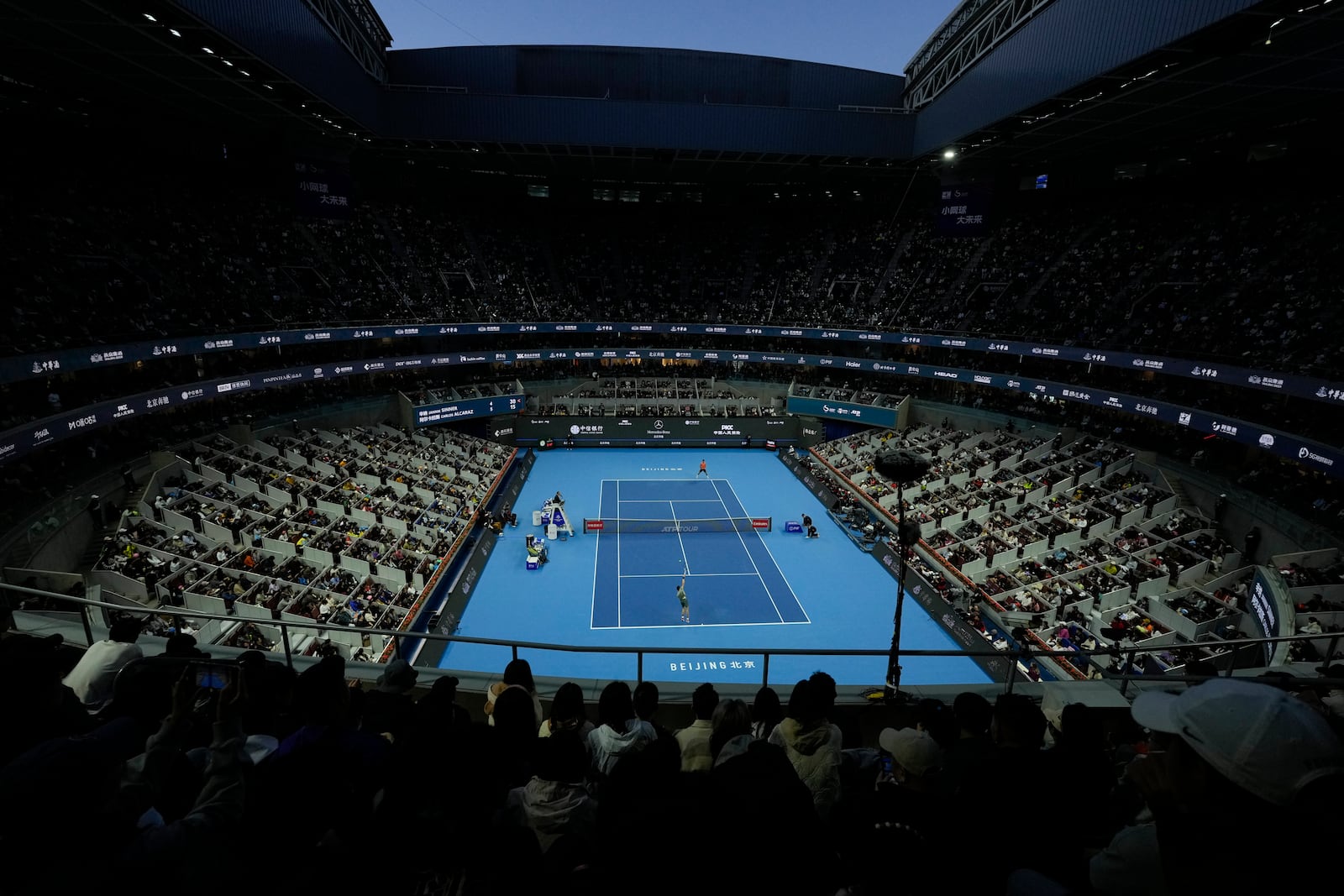 Jannik Sinner of Italy serves against Carlos Alcaraz of Spain during their men's singles finals match of the China Open tennis tournament, at the National Tennis Center in Beijing, Wednesday, Oct. 2, 2024. (AP Photo/Andy Wong)