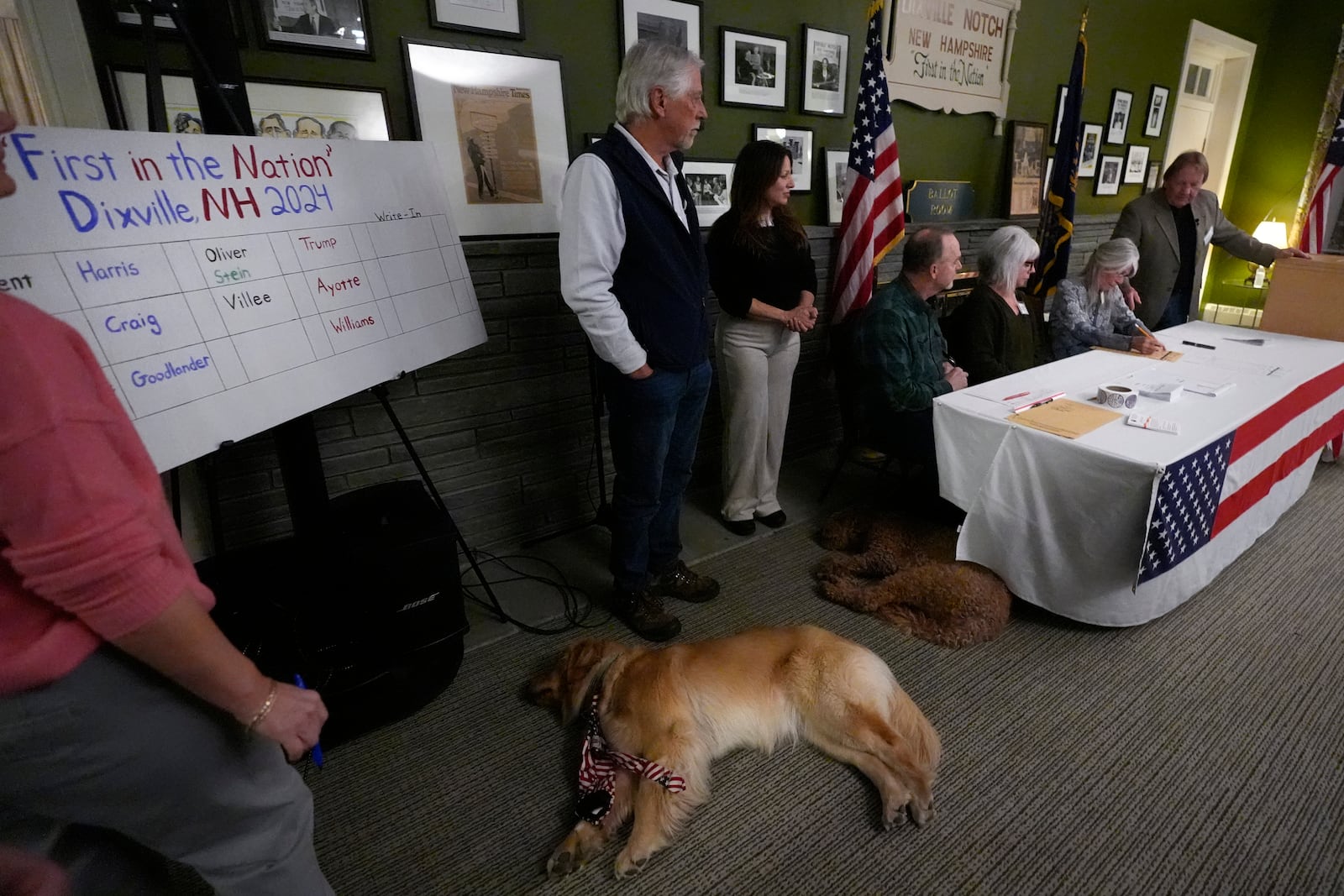 Town officials count the ballots after voters cast their ballots on Election Day, Tuesday, Nov. 5, 2024, in Dixville Notch, N.H. (AP Photo/Charles Krupa)