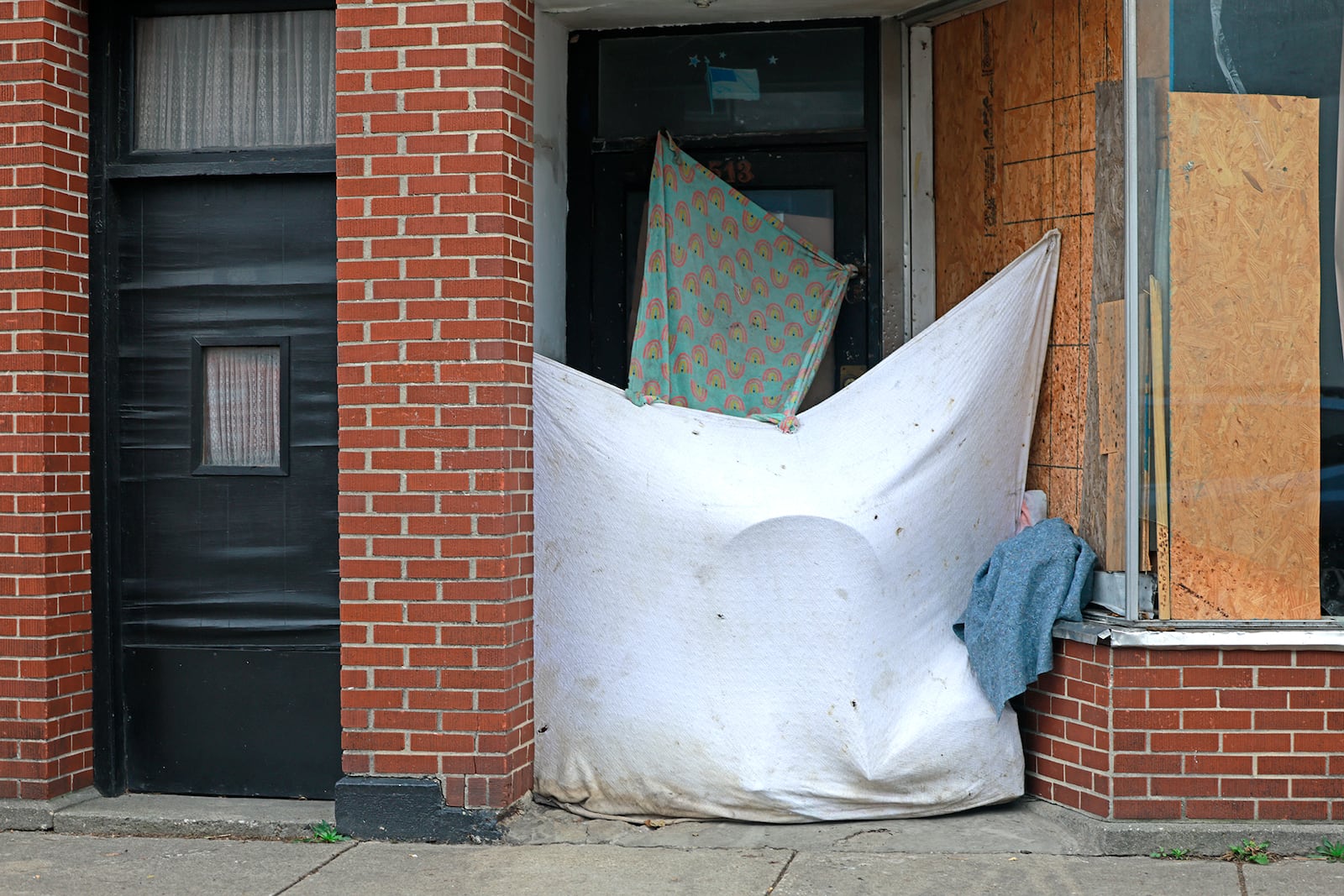 A makeshift shelter constructed by a homeless person in the doorway of a vacant business along West Main Street in Springfield Wednesday, Nov. 27, 2024. BILL LACKEY/STAFF