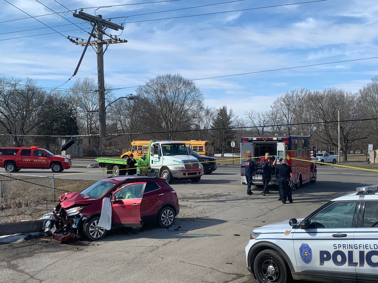 A vehicle crashed into a utility pole, snapping off the bottom section and bringing down wires on West Main Street at Park Drive on the west side of Springfield Friday afternoon Feb. 26, 2021. BILL LACKEY/STAFF