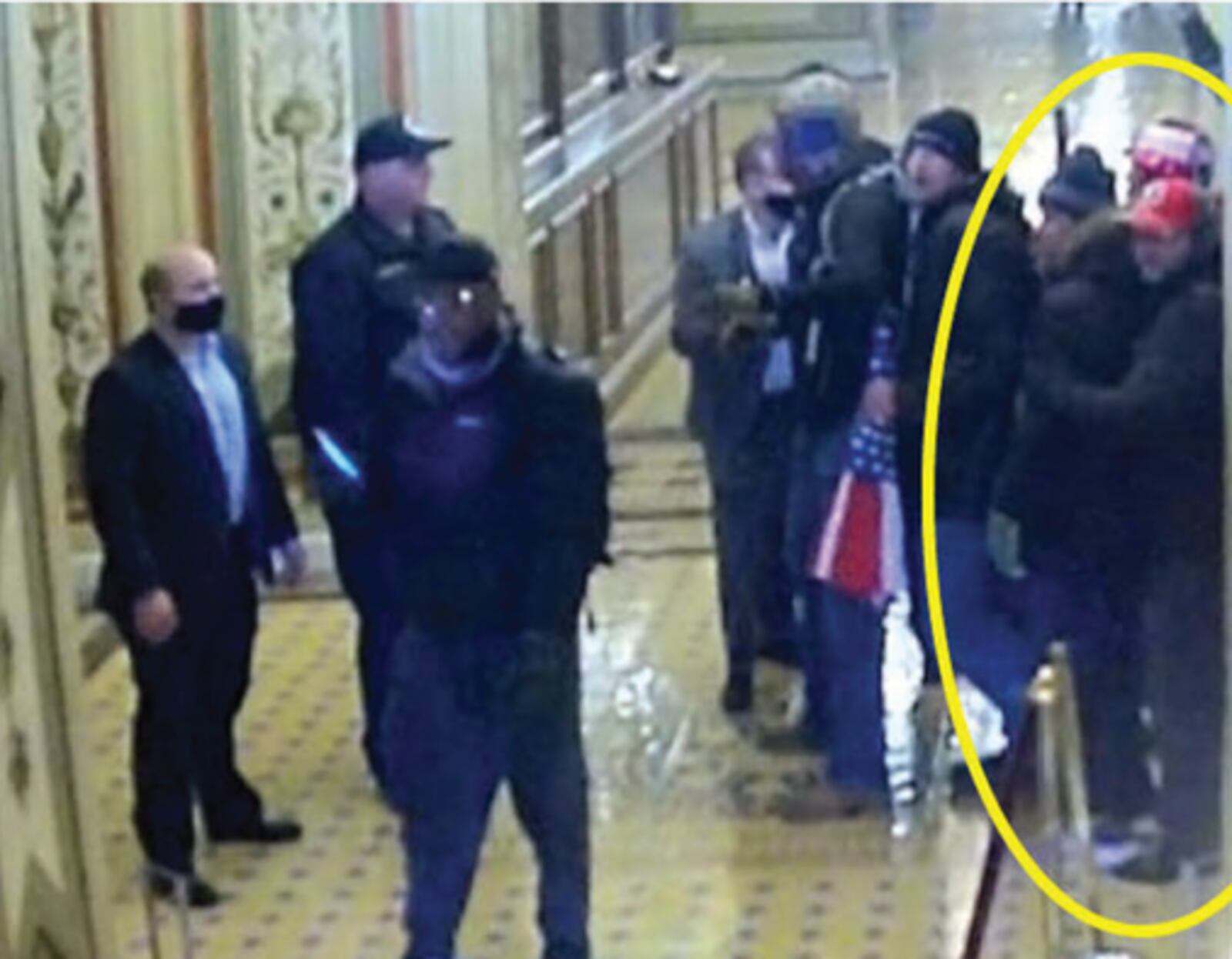 These photos from a federal court document allegedly show twin brothers Steven and Robert Hanna in the crowd of rioters at the U.S. Capitol building on Jan. 6, 2021.