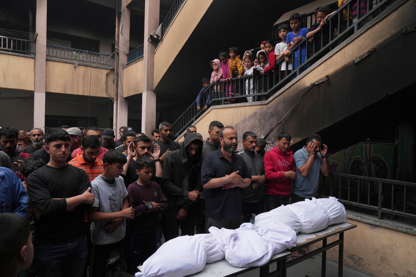 Palestinians bid farewell to their relatives who were killed in Israeli airstrikes early this morning on Yaffa School, in Gaza City, Wednesday, April 23, 2025. (AP Photo/Jehad Alshrafi)