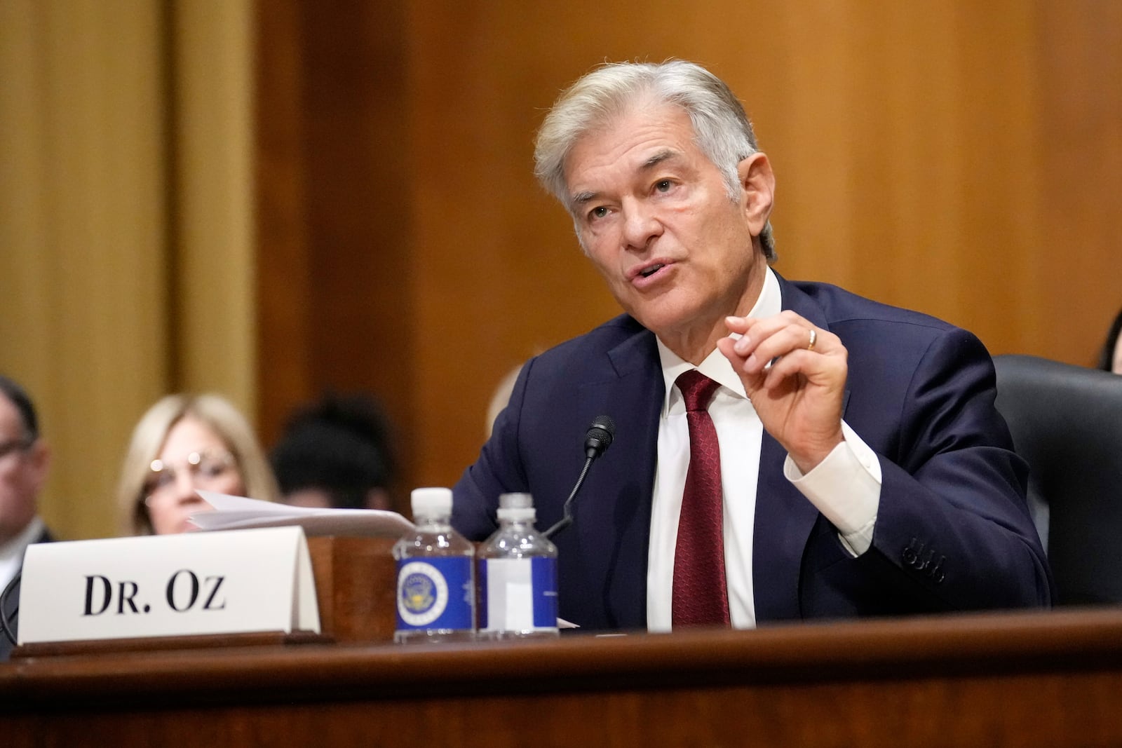 Dr. Mehmet Oz, President Donald Trump's pick to lead the Centers for Medicare and Medicaid Services, testifies at his confirmation hearing before the Senate Finance Committee, on Capitol Hill in Washington, Friday, March 14, 2025. (AP Photo/Ben Curtis)