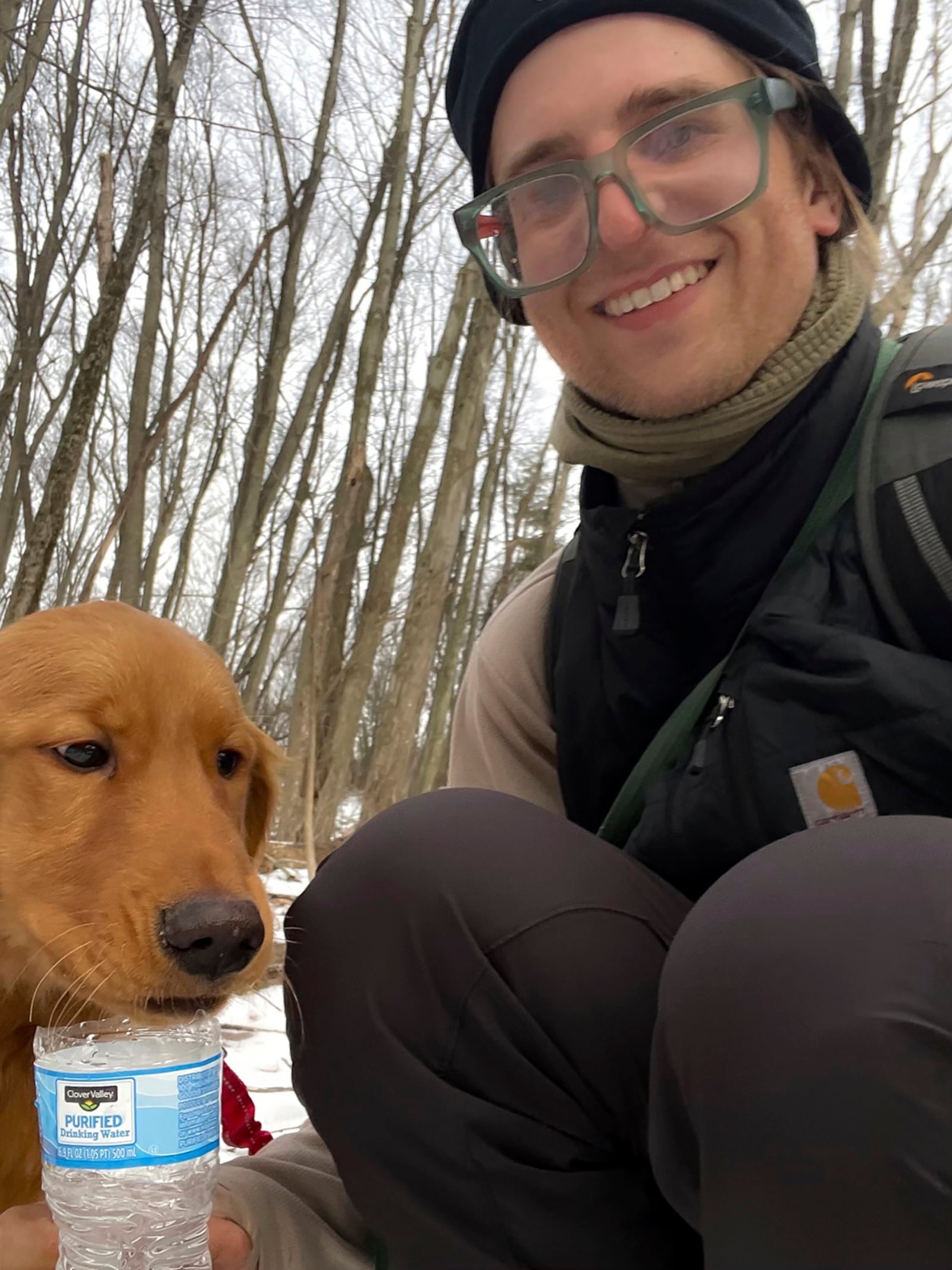 In this Feb. 24 2025 photo provided by Collin Leiby, shown is Leibya moments after he found a missing six-month-old Golden pup named Freddy, a week after the dog ran off from his home at the base of Sharp Mountain in Pottsville, Pa. (Collin Leiby via AP)