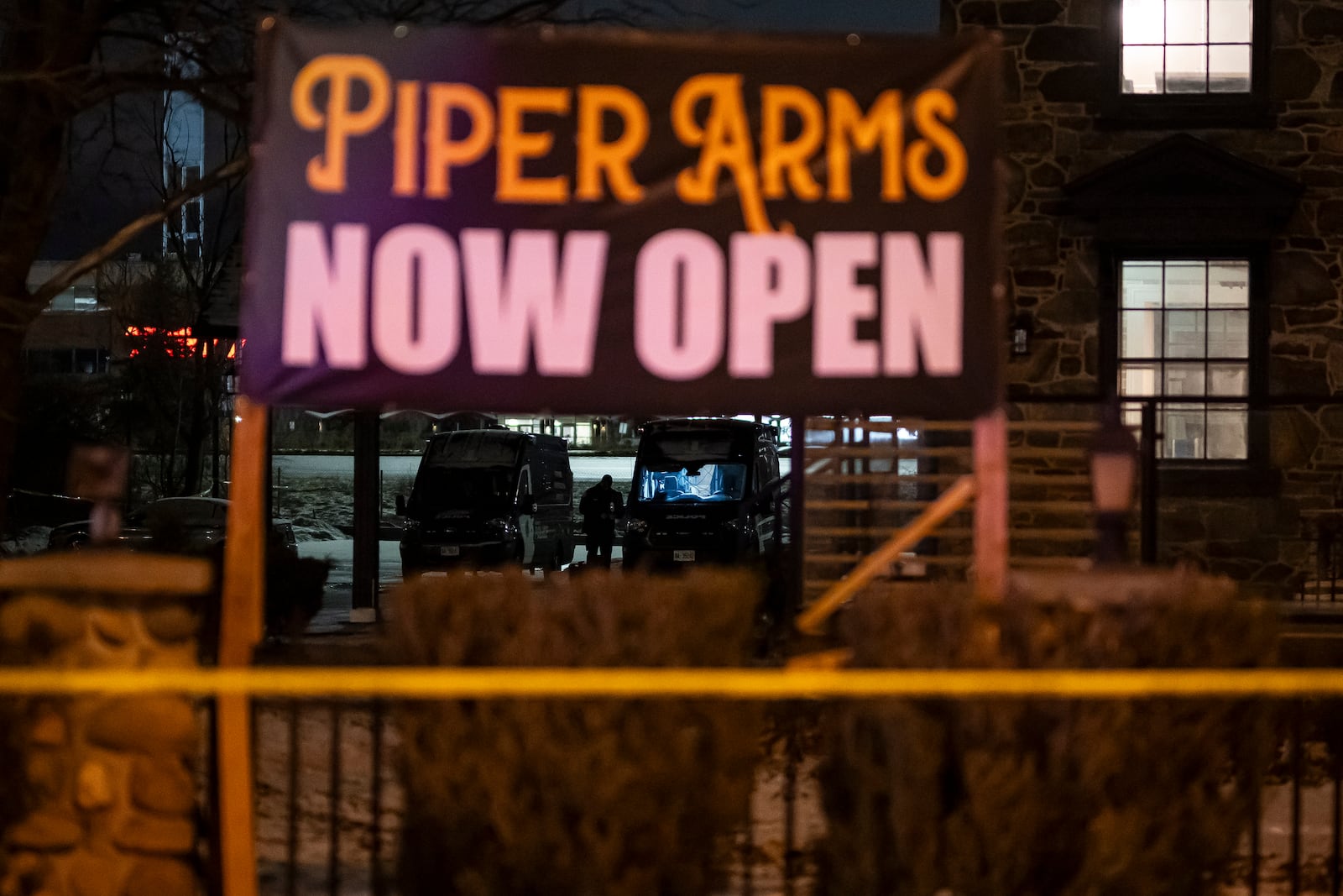 Toronto Police investigate a shooting at the Piper Arms Pub near the Scarborough Town Centre in Toronto on Saturday, March 8, 2025. (Christopher Katsarov/The Canadian Press via AP)