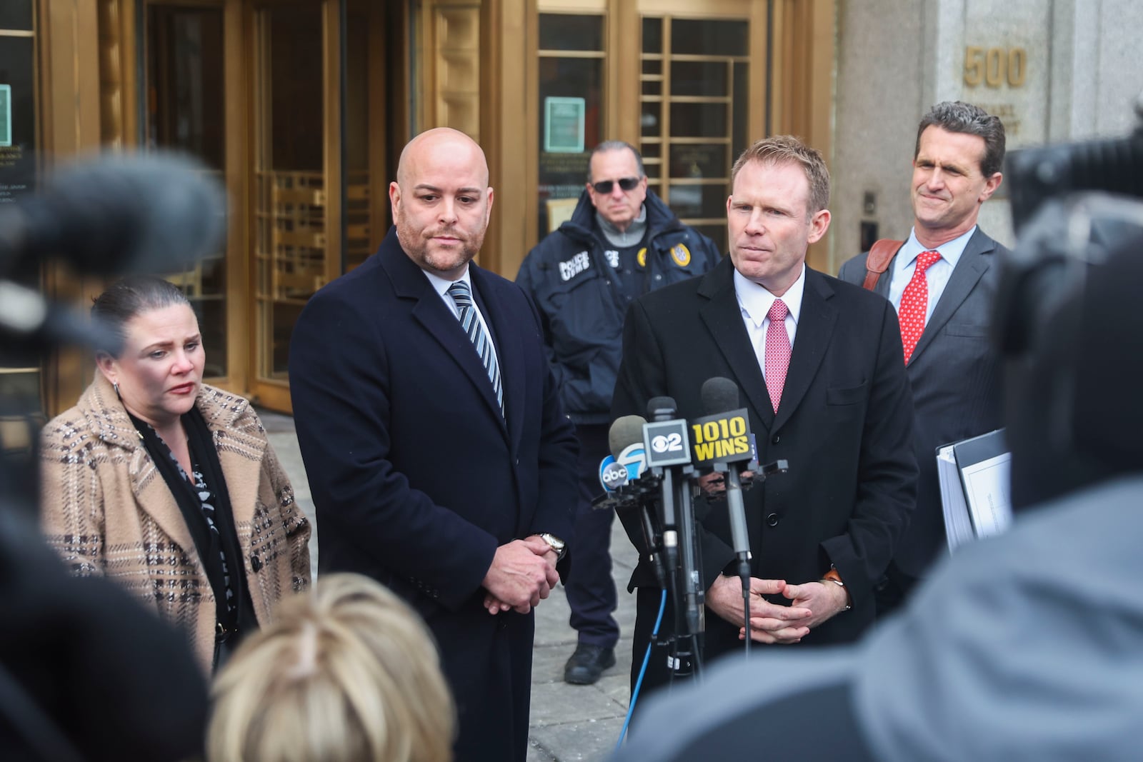 Attorney Joseph Cammarata, left, stands next to Andrew Giuliani while taking questions from the press outside of federal court, Thursday, Jan. 16, 2025, in New York. (AP Photo/Heather Khalifa)