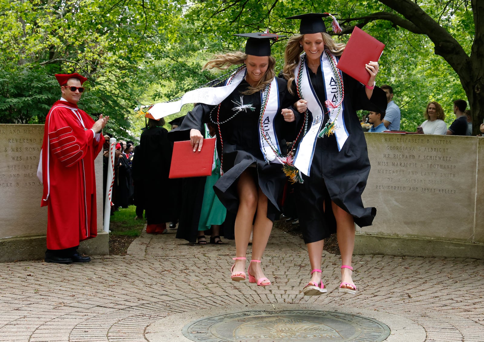 Wittenberg University graduates participate in the Stomp the Seal tradition Saturday, May 11, 2024 following the school's 174th commencement ceremony. BILL LACKEY/STAFF