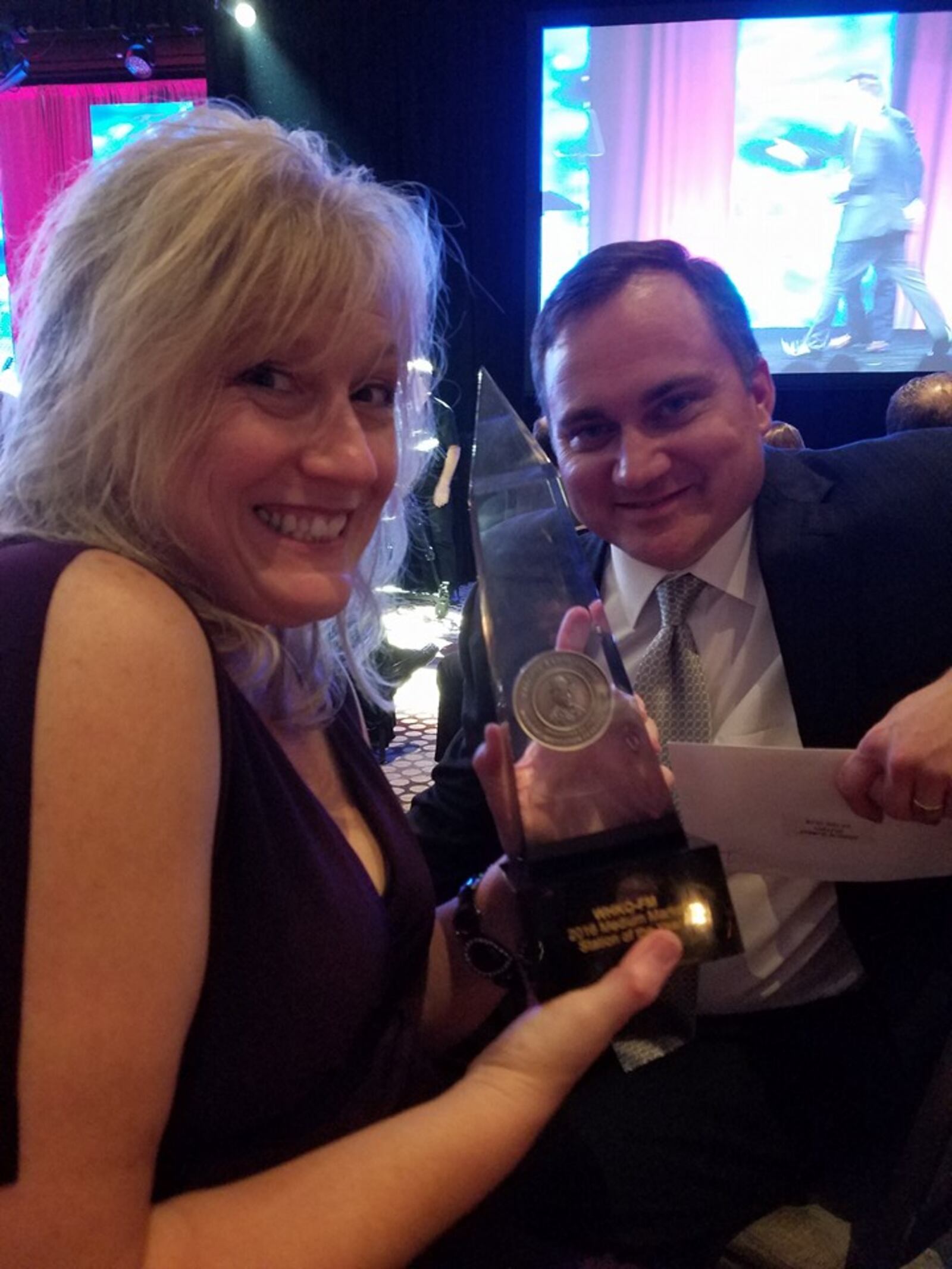 Nancy Wilson, co-host of the K99 morning show, and Rob Rohr, Cox Media Group Ohio Market Vice President, celebrate Thursday night, Sept. 22, 2016, after Dayton’s No. 1 country music station K99.1FM (WHKO-FM) wins a Marconi award for the 2016 station of the year for its market during the National Association of Broadcasters Marconi Radio Awards Dinner & Show in Nashville.