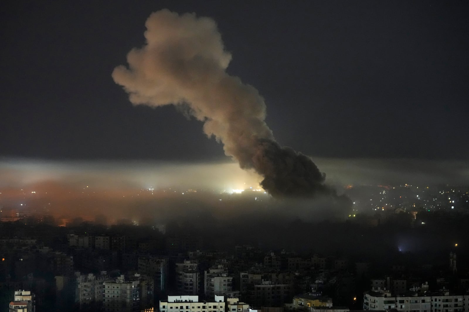 Smoke rises from an Israeli airstrike on Dahiyeh, in the southern suburb of Beirut, Lebanon, early Sunday, Oct. 27, 2024. (AP Photo/Hussein Malla)