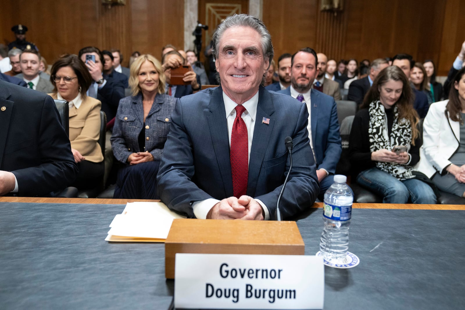 Former Gov. Doug Burgum, President-elect Donald Trump's choice to lead the the Interior Department as Secretary of the Interior, arrives to testify before the Senate Energy and Natural Resources Committee on Capitol Hill in Washington, Thursday, Jan. 16, 2025. (AP Photo/Jose Luis Magana)