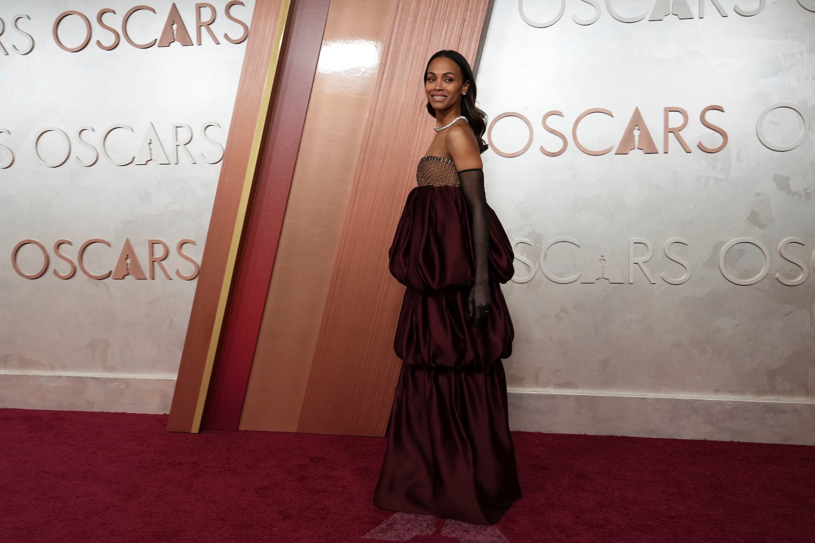 Zoe Saldana arrives at the Oscars on Sunday, March 2, 2025, at the Dolby Theatre in Los Angeles. (Photo by Jordan Strauss/Invision/AP)