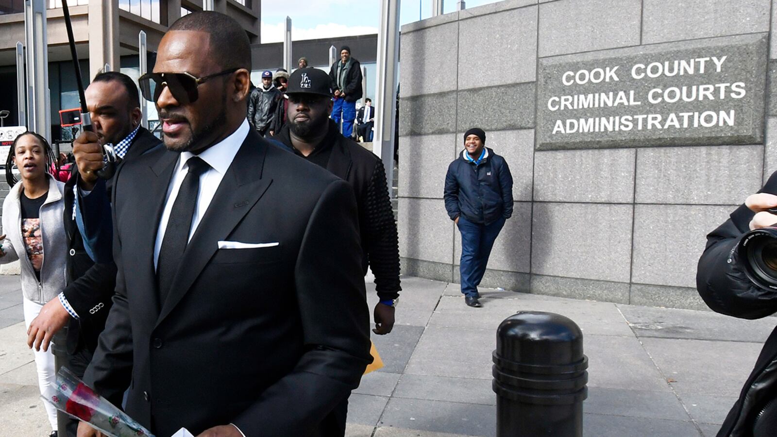 In this March 22, 2019 photo, R. Kelly, leaves the Leighton Criminal Court building after a hearing in Chicago. A Cook County judge has entered a default judgment for a woman who sued Kelly in February, accusing the singer of sexually abusing her when she was a minor 20 years ago. A Wednesday, April 24, 2019, Chicago Sun-Times report says the court will enter an amount Kelly should pay next month. It ruled Kelly in default Tuesday after he never responded to summonses.