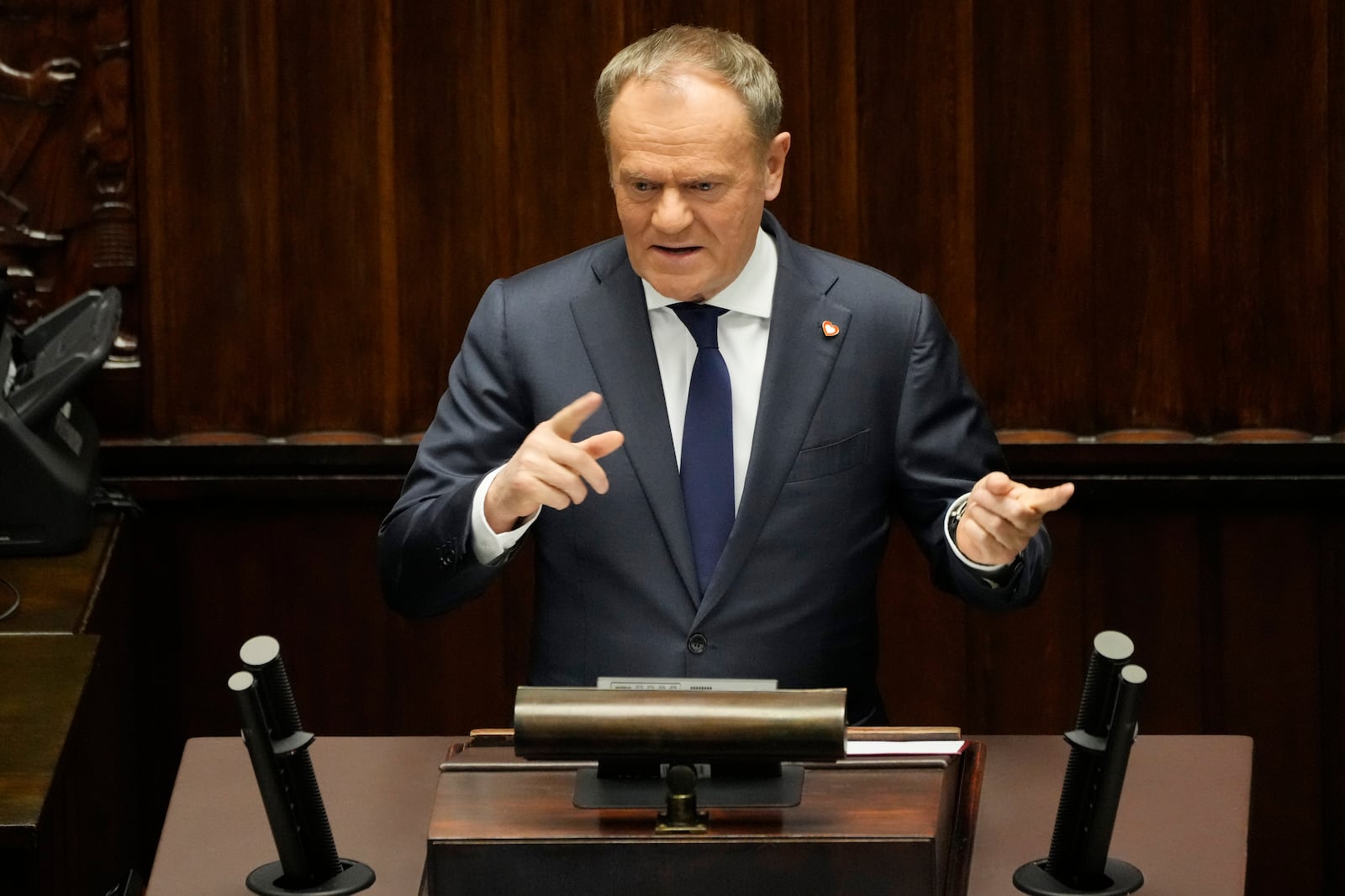 Polish Prime Minister Donald Tusk speaks at the Sejm, the lower house of parliament, in Warsaw, Poland, Friday March 7, 2025. (AP Photo/Czarek Sokolowski)