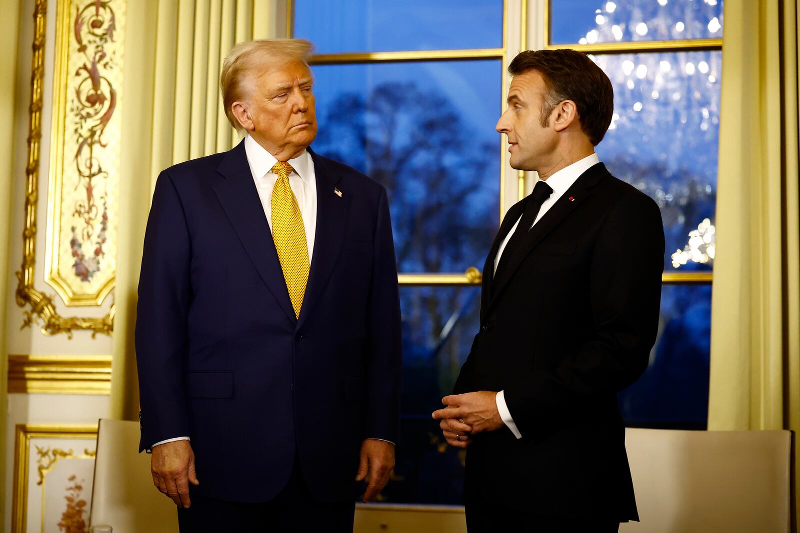 FILE - President-elect Donald Trump, left, attends a meeting with France's President Emmanuel Macron at the Elysee Palace in Paris, Dec. 7, 2024. (Sarah Meyssonnier/Pool via AP, File)