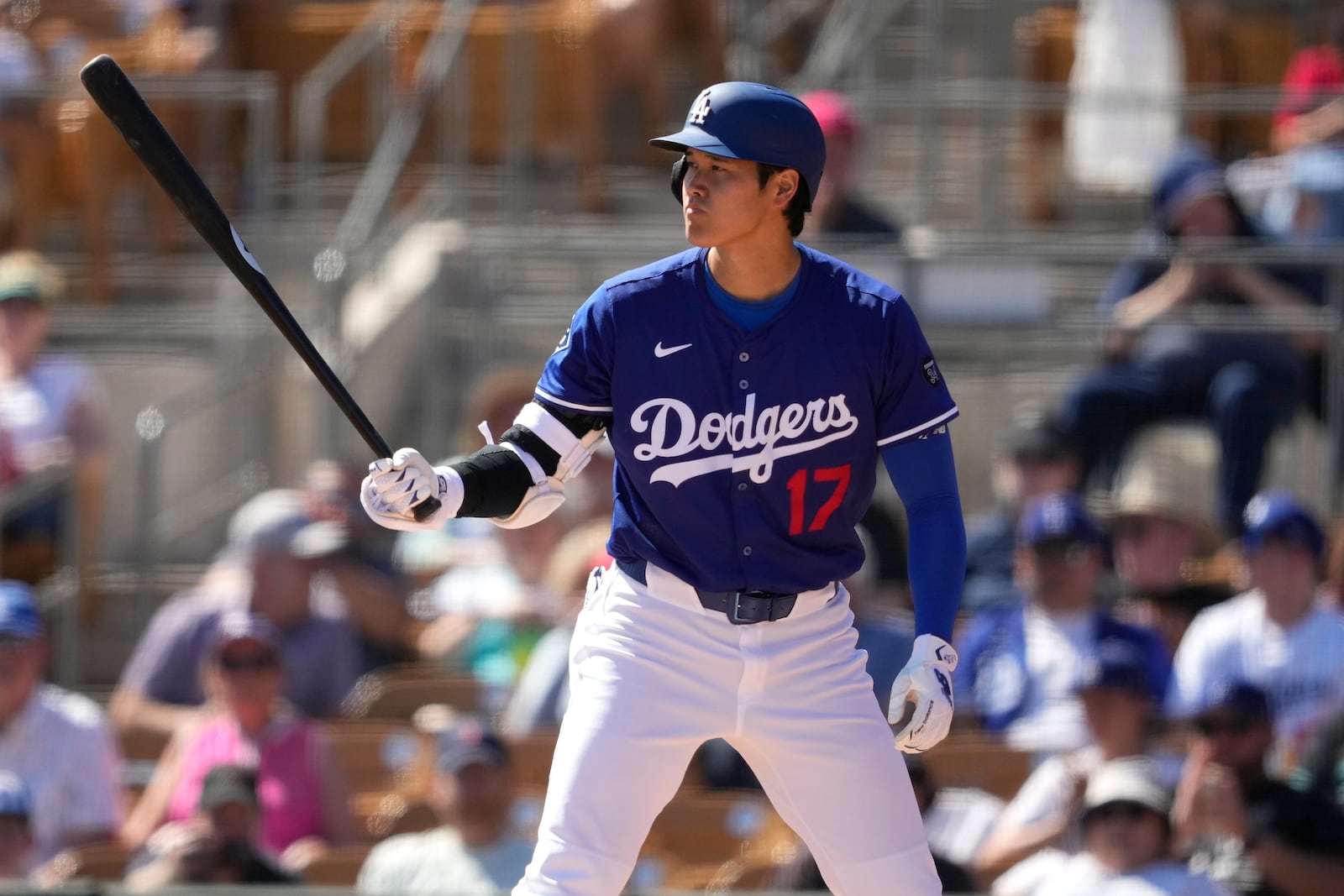 Los Angeles Dodgers' Shohei Ohtani hit against the Arizona Diamondbacks during the second inning of a spring training baseball game, Monday, March 10, 2025, in Phoenix. (AP Photo/Matt York)