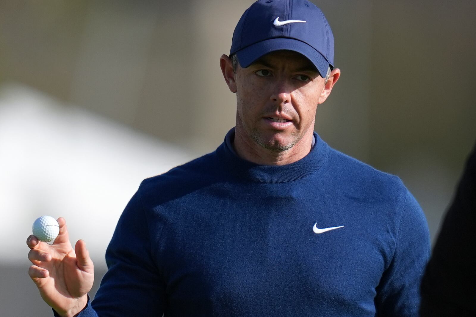 Rory McIlroy, of Northern Ireland, waves after his birdie putt on the 15th green of the South Course at Torrey Pines during the second round of the Genesis Invitational golf tournament Friday, Feb. 14, 2025, in San Diego. (AP Photo/Gregory Bull)