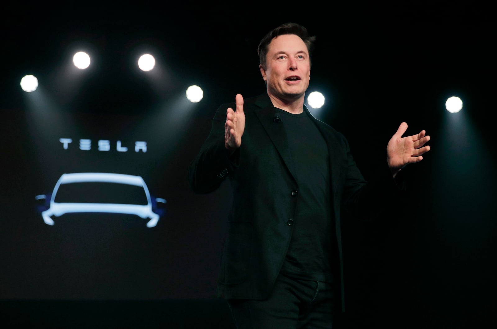 FILE- Tesla CEO Elon Musk speaks before unveiling the Model Y at Tesla's design studio, March 14, 2019, in Hawthorne, Calif. (AP Photo/Jae C. Hong, File)