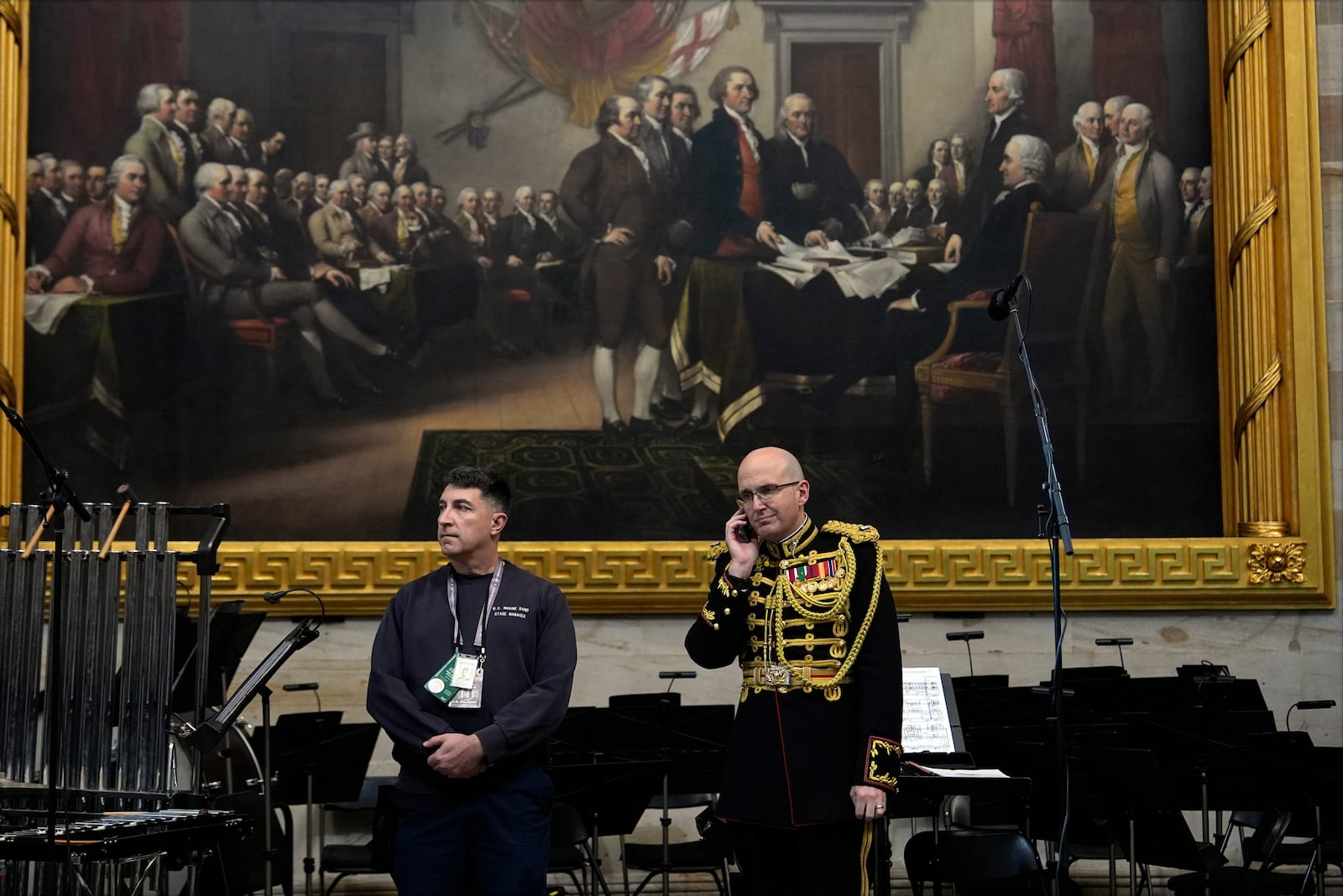 Director of "The President's Own" U.S. Marine Band, Lt. Col. Ryan Nowlin talks on the phone before the 60th Presidential Inauguration in the Rotunda of the U.S. Capitol in Washington, Monday, Jan. 20, 2025. (AP Photo/Julia Demaree Nikhinson, Pool)