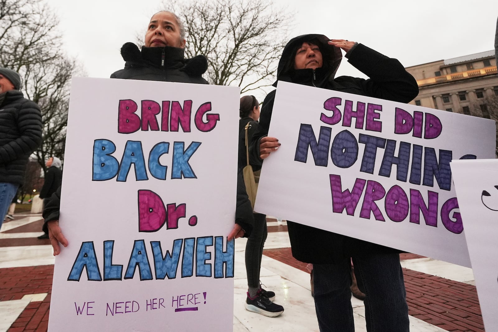 Protesters rally outside the Rhode Island State House in support of deported Brown University Dr. Rasha Alawieh, Monday, March 17, 2025, in Providence, R.I. (AP Photo/Charles Krupa)