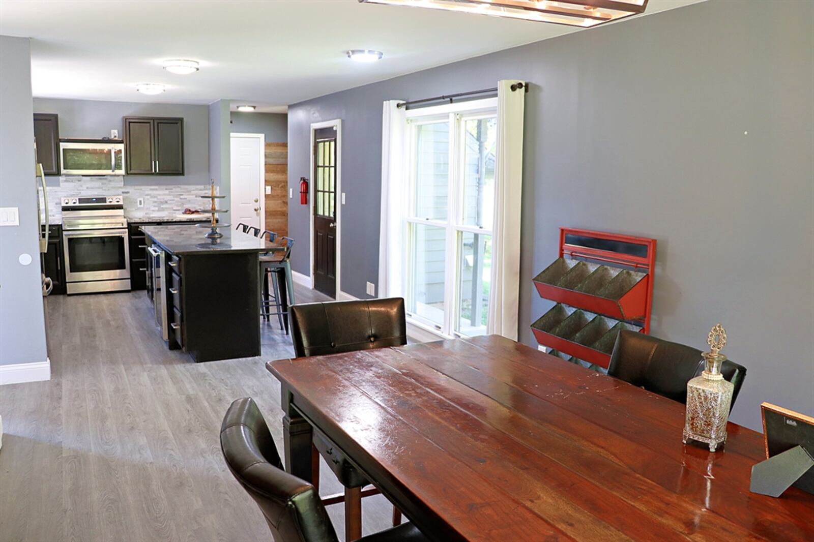 The combined kitchen and dining room have been redesigned during the past two years. A wall was removed to open the two rooms. 