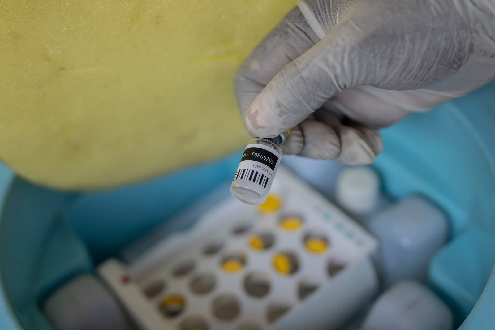 A nurse holds a bottle of mpox vaccine at the General hospital, in Goma, Democratic Republic of Congo Saturday, Oct. 5, 2024. (AP Photo/Moses Sawasawa)